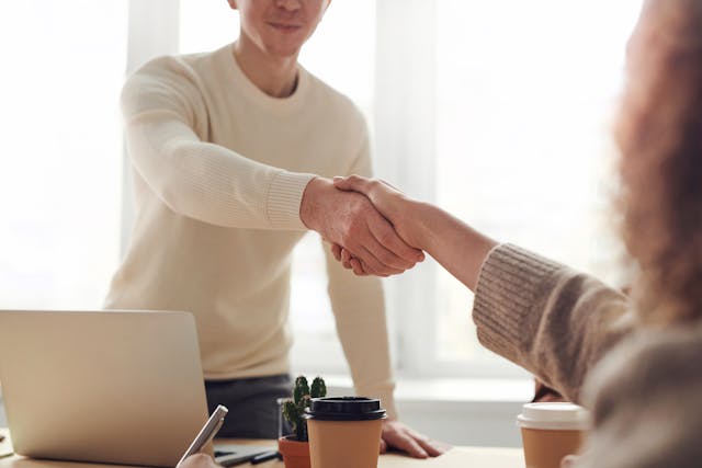 Man and woman shaking hands - Long Term Market Plans